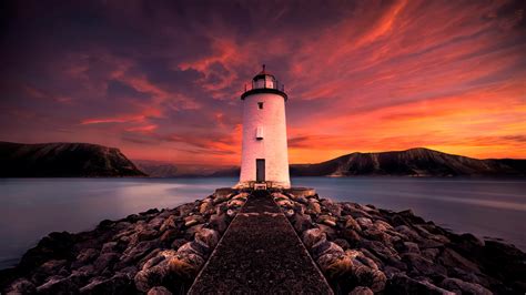 Lighthouse At Sunset 4k Ultra Hd Wallpaper Background Image 3840x2160