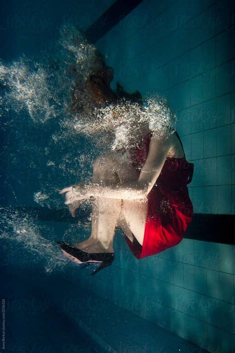 Woman In Red Dress Underwater Wearing Fashion Shoes With High Heels By