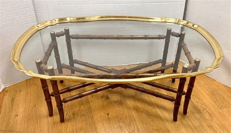 Glamorous design, inspired by mesmerising geometric patterns from the alhambra palacehigh quality, steel construction with brass effect finishsolid marble topdue to its natural formation every piece of marble is unique. Baker Furniture Brass and Glass Tray Top Cocktail Table on ...