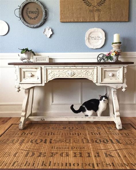 This vintage white desk has a black top and a white wood side chair nearby. Chippy White Farmhouse Desk | White farmhouse, Traditional ...