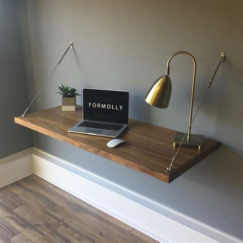 The writing desk provides the ideal surface for studying or creative projects. **FREE SHIPPING IN THE USA** Walnut Wall Mounted Floating ...
