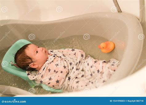 Bathing A Newborn At Home A Picture Of A Newborn Baby From The First