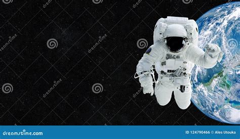 Astronaut In An Outer Space Against The Backdrop Of The Planet Stock