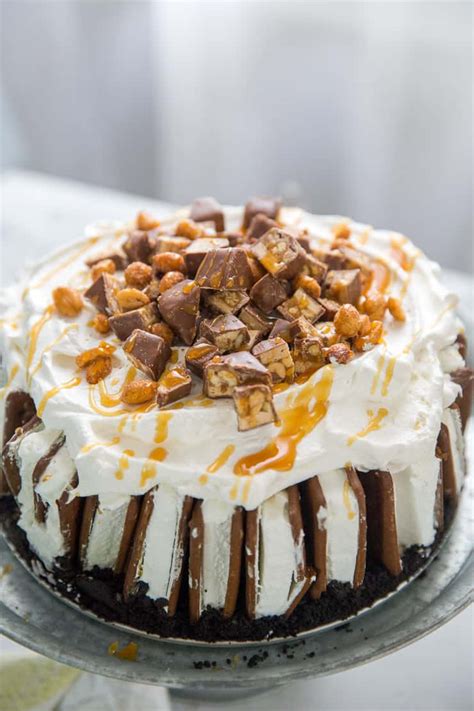Serve directly from the machine for soft serve, or store in freezer until needed. Snickers Ice Cream Cake Recipe | LemonsforLulu.com
