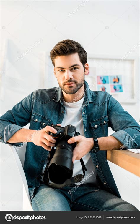 Handsome Young Photographer Holding Photo Camera Office — Free Stock