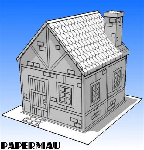 A Paper Model Of A House On Top Of A Piece Of Paper With The Words