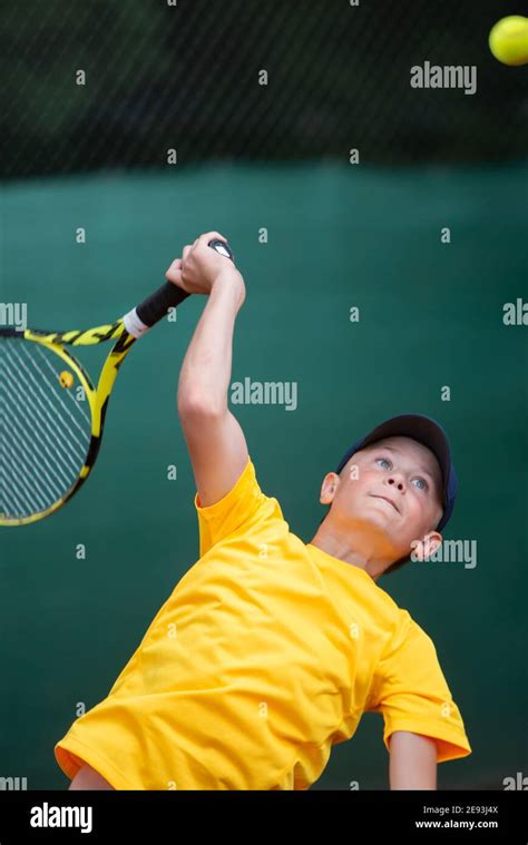 Boy Playing Tennis Stock Photo Alamy