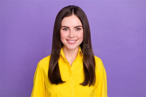 portrait of attractive cheerful brunette girl wearing bright shirt isolated over vivid violet