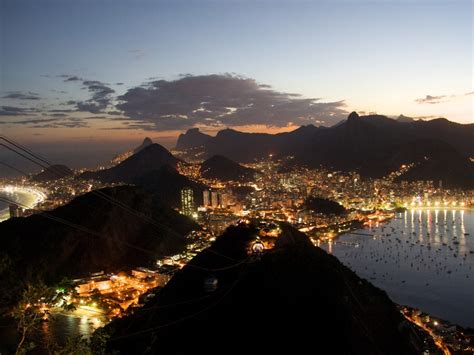 A panning shot from a lookout point over rio de janeiro, brazil. Rio De Janeiro Night : Wallpapers13.com