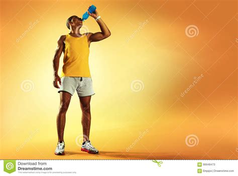 Young Muscular Build Man Drinking Water Of Bottle Stock Image Image
