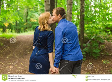 Romantic Young Couple In Love Relaxing Outdoors In Park Stock Photo