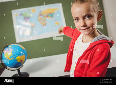 Girl Pointing On World Map Stock Photo Alamy