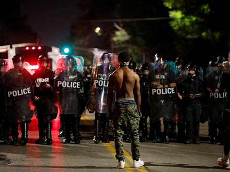 st louis police officers charged with kicking and beating undercover detective in street protest