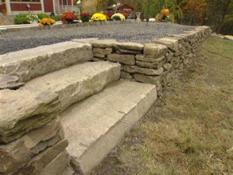 A Dry Stack Stone Retaining Wall Not Only Holds Back The Earth It Adds