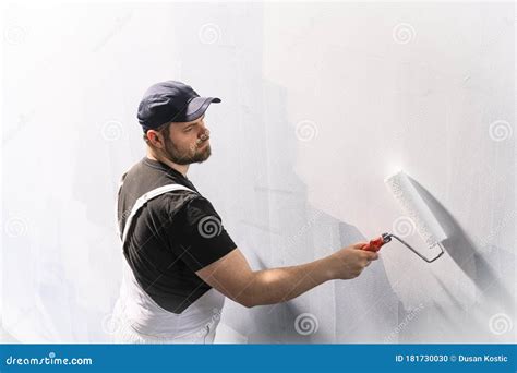 Man Painting A Wall In White Color Stock Photo Image Of Painting