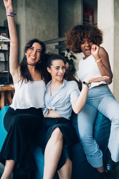 Premium Photo Three Young Multiracial Women Having Fun And Posing Together In Modern Loft