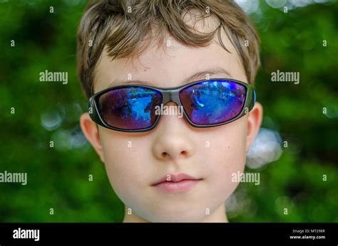 A Close Up Portrait Of A Boy Wearing Sunglasses Stock Photo Alamy