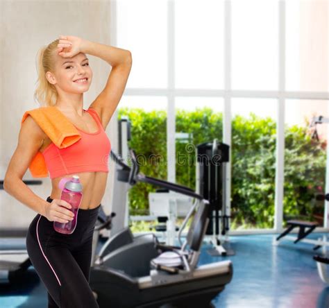 Smiling Sporty Woman With Towel And Water Bottle Stock Photo Image Of