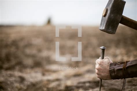 Stock Photo Roman Soldier Hammering Nail Into The Cross By Pearl