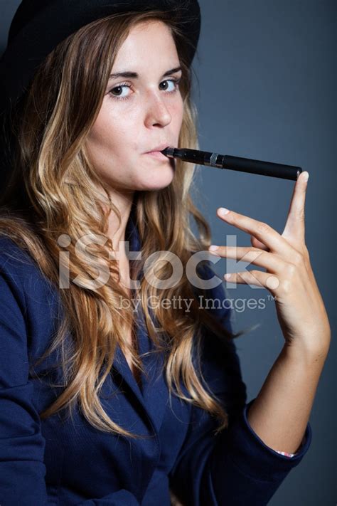 Elegant Woman Holding And Smoking E Cigarette Stock Photo Royalty