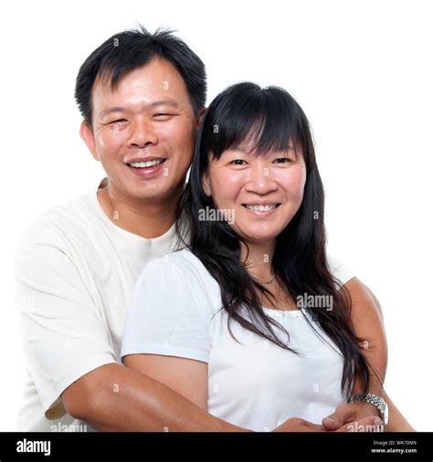 Happy Southeast Asian Mature Couple Hugging And Smiling Isolated On