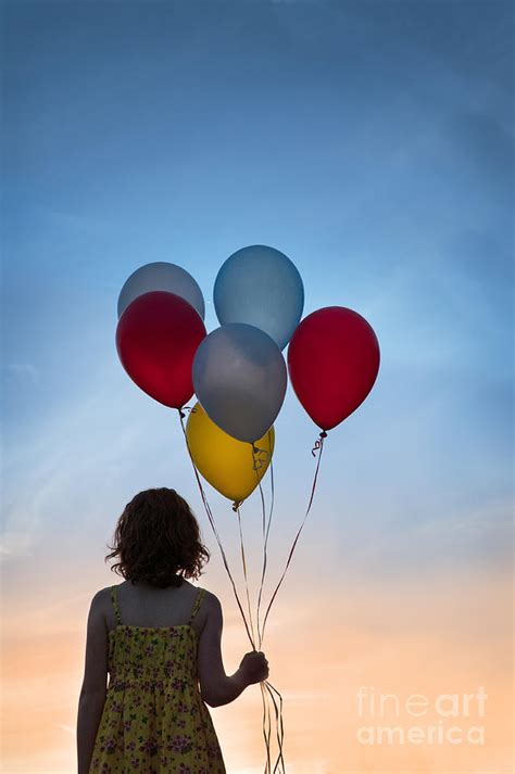Girl Holding Balloons Facing The Setting Sun Photograph By Lee Avison