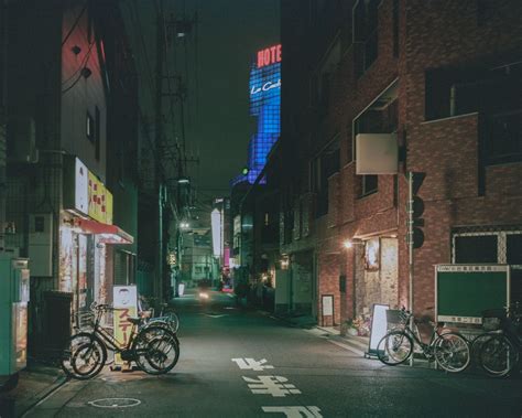 Nighttime Reflections Captivating Streets Of Tokyo