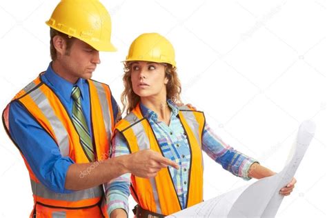 Attractive Male And Female Construction Workers Looking At Blue