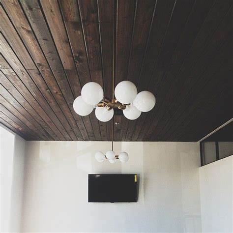 Choose a fixture suitable for the amount of light you need. Dark wood panels on our vaulted living room ceiling would ...