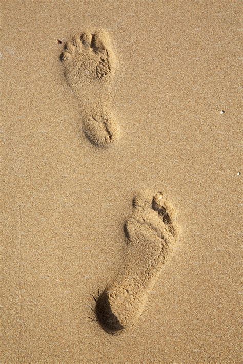 Footprints On Sand On The Beach Containing Foot Print And Footprint