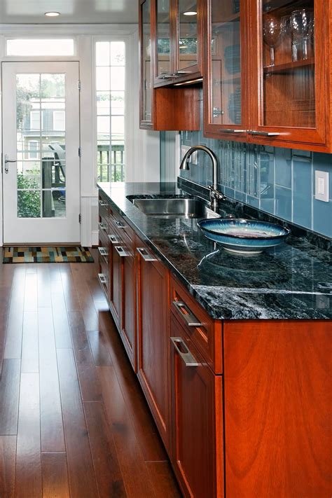 Contemporary kitchen combined darker brown cabinet and silestone lagoon counters. 40 + Popular Blue Granite Kitchen Countertops Design Ideas