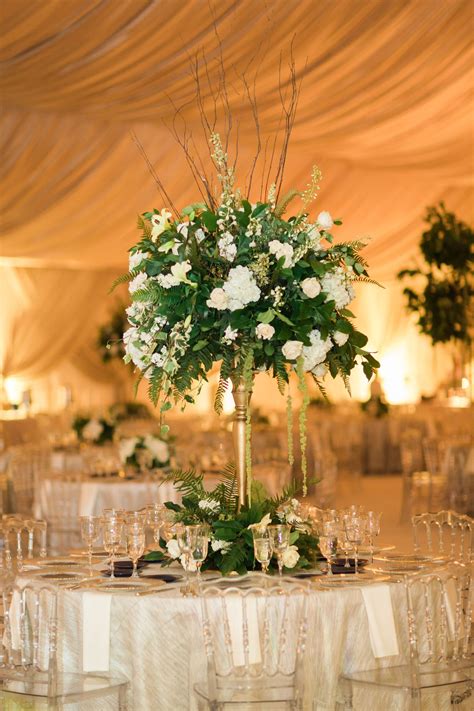 Tall Greenery And White Flower Centerpiece