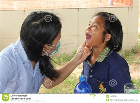 Doctor Is Checking The Oral Cavity Of A Student Editorial Photography