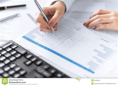 Woman Hand Writing On Paper With Numbers Stock Photography