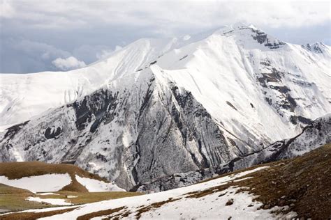 Snow Capped Peaks Of The Caucasus Mountains Landscape Along The