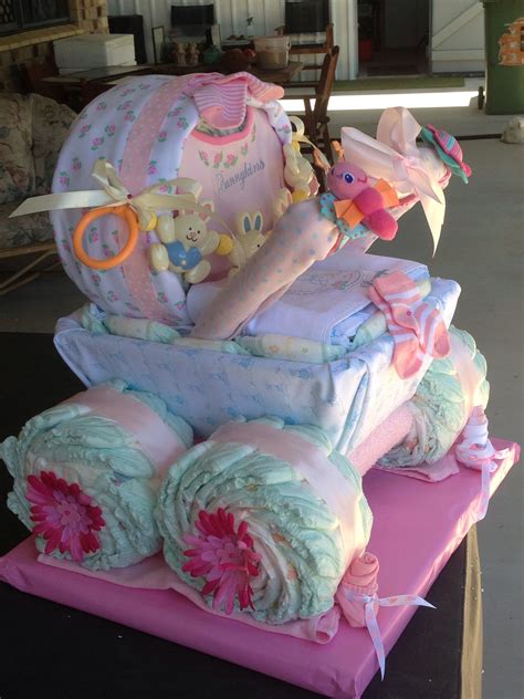 Learn how to make an adorable and practical diaper cake. Pram nappy cake for twin girls (With images) | Creative ...