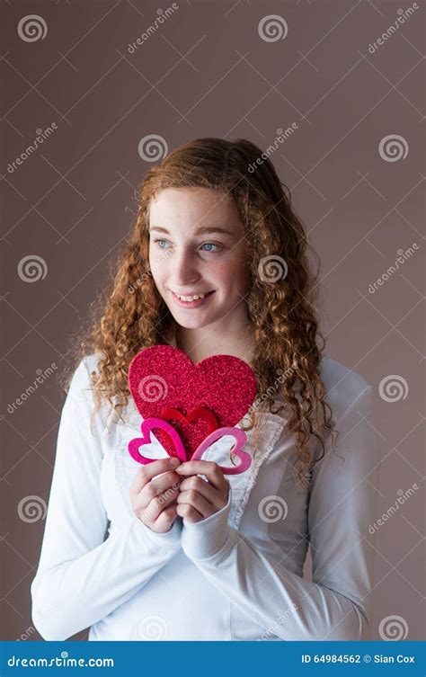 Teen Girl Holding Hearts Stock Photo Image Of Cute Girl 64984562