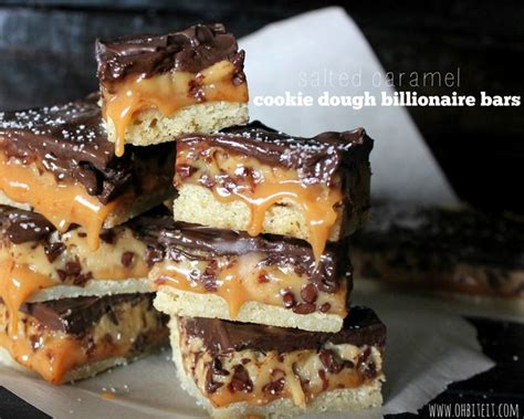 Salted Caramel Blondie Bars Stacked On Top Of Each Other With Chocolate
