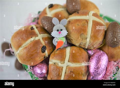 Easter Food In A Basket With Hot Cross Buns And Chocolate Easter Eggs