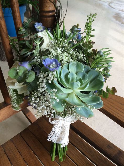 If you like the idea of a small and light bouquet you might want to consider a large succulents surrounded by small echeverias and filler flowers. Bridal succulent bouquet | Succulent bouquet, Wedding ...