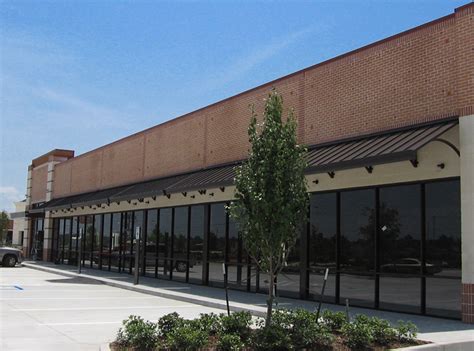 Our overhead metal canopies feature extruded or roll form decking and fascia parasol awnings also offers mapes canopies products, superior mason products and ballews aluminum products. Metal Awnings & Canopies | Accent Sign & Awning