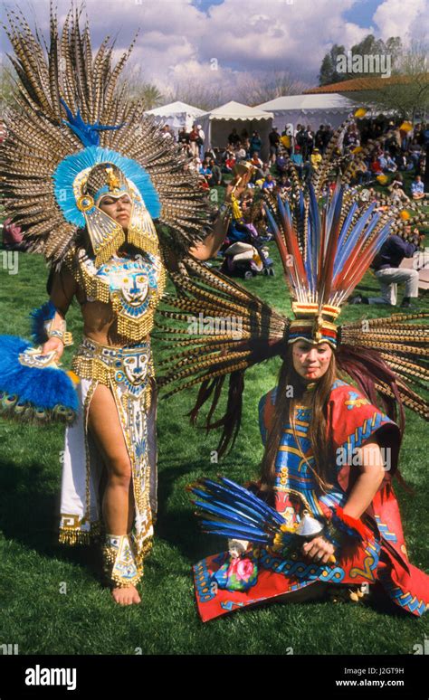 Two Aztec Women Dressed In Magnificent Traditional Aztec Regalia And