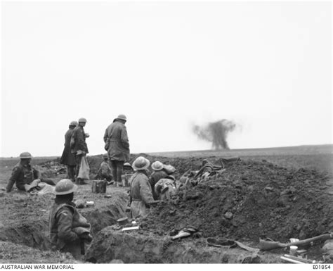 Soldiers In A Trench Watch A Shell Bursting Near The Reserve Trenches