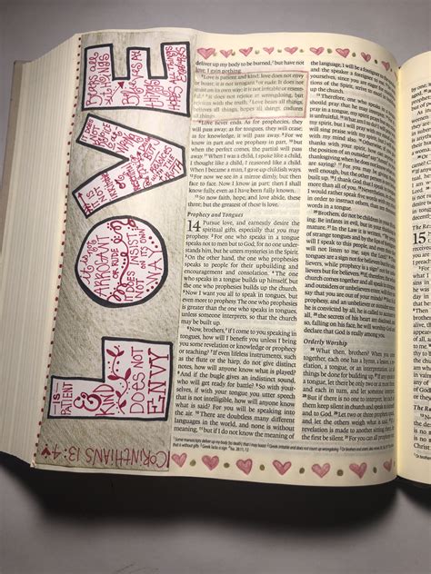 An Open Book With The Word Love Written In Red And Black On It S Pages