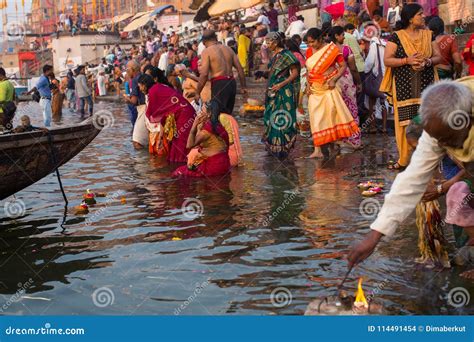Pilgrims Plunge Into The Water Holy Ganges River In The Early Morning