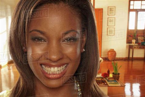 Smiling African American Woman In Living Room Stock Photo Dissolve