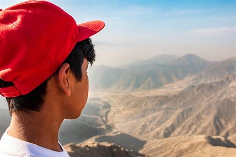 Premium Photo 14 Year Old Boy Looking From The Mountain Towards The