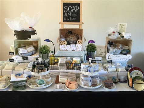 A Table Topped With Lots Of Different Types Of Soaps And Other Items On