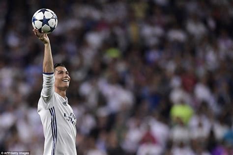 Ronaldo Holds The Match Ball Aloft After His Hat Trick Sent Bayern