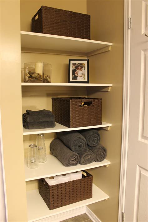 The simplicity of this shelving unit proves that storage solutions in limited. KM Decor: DIY: Organizing Open Shelving in a Bathroom